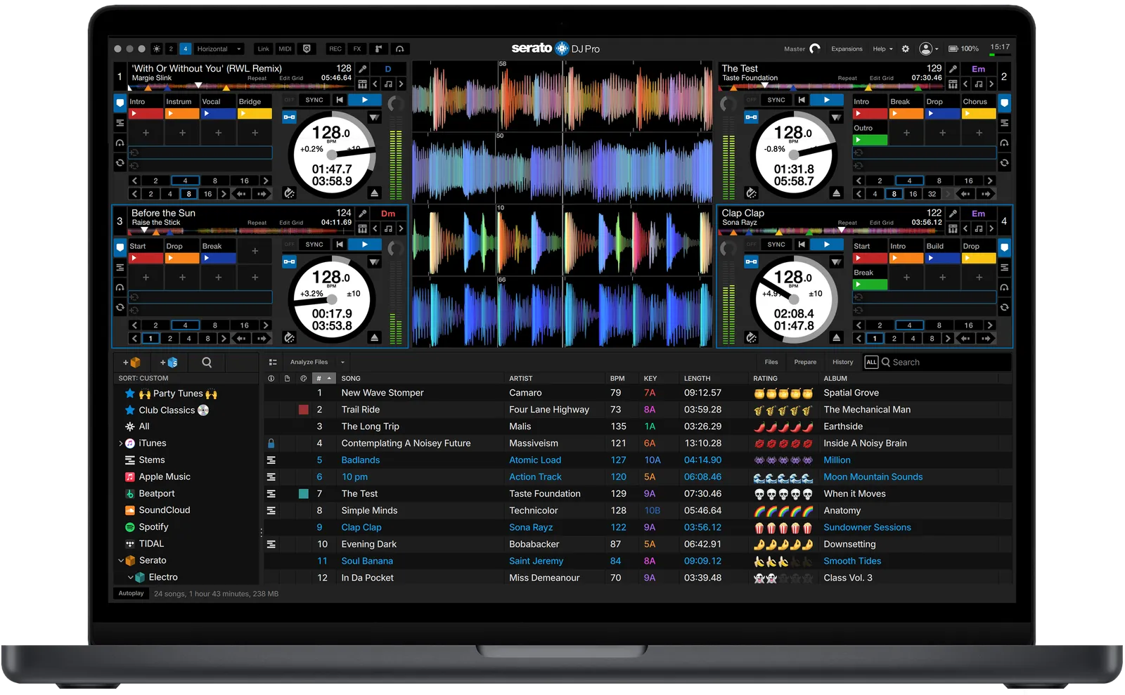 Serato DJ Pro in the four-deck horizontal view above the library, on a laptop