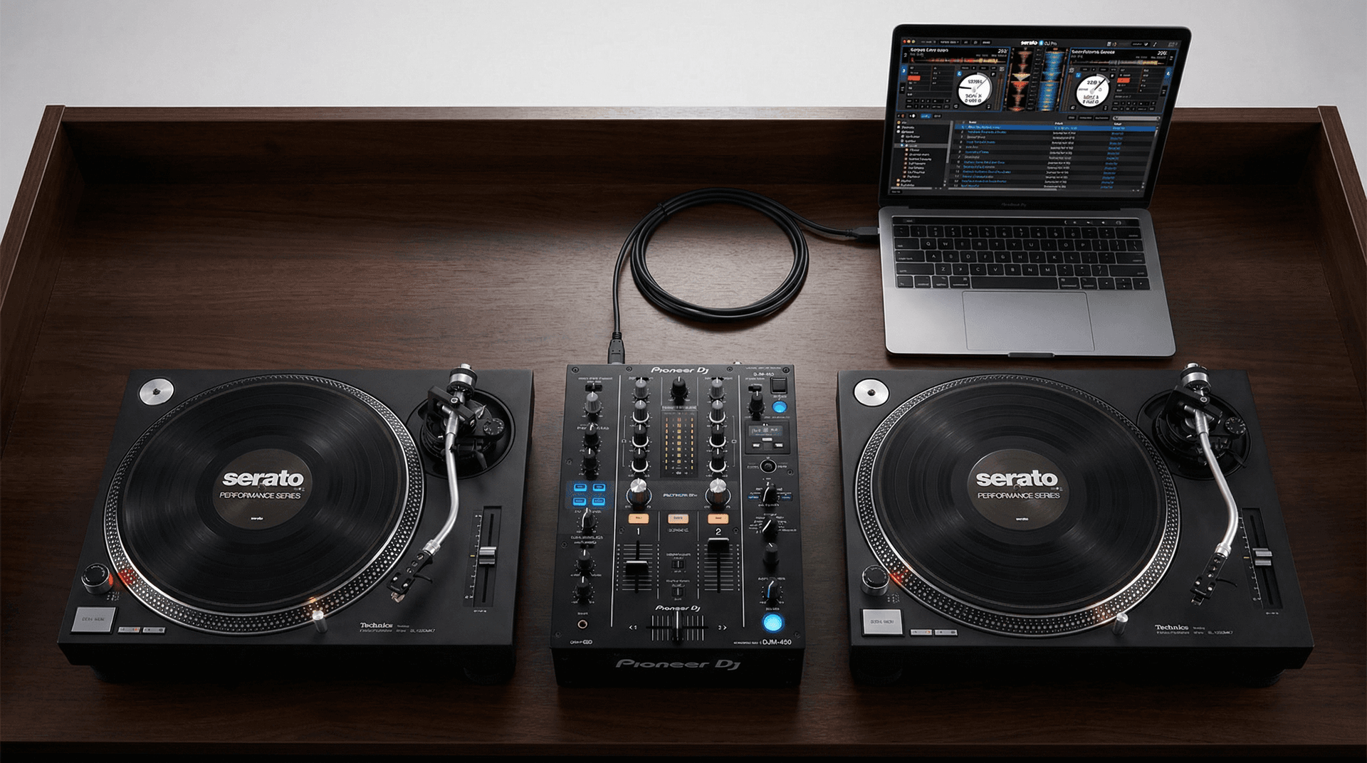 Pioneer DJ DJM-450 mixer with Serato interface on laptop screen showing DVS control mode