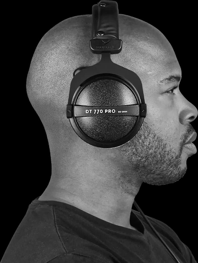 A man wearing the Beyerdynamic DT 770 PRO 80 ohm, seen in profile