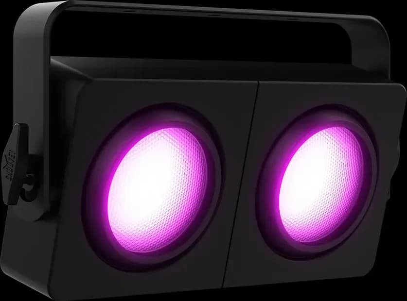 Both lenses of the Chauvet DJ Shocker P2 lit in pink against black
