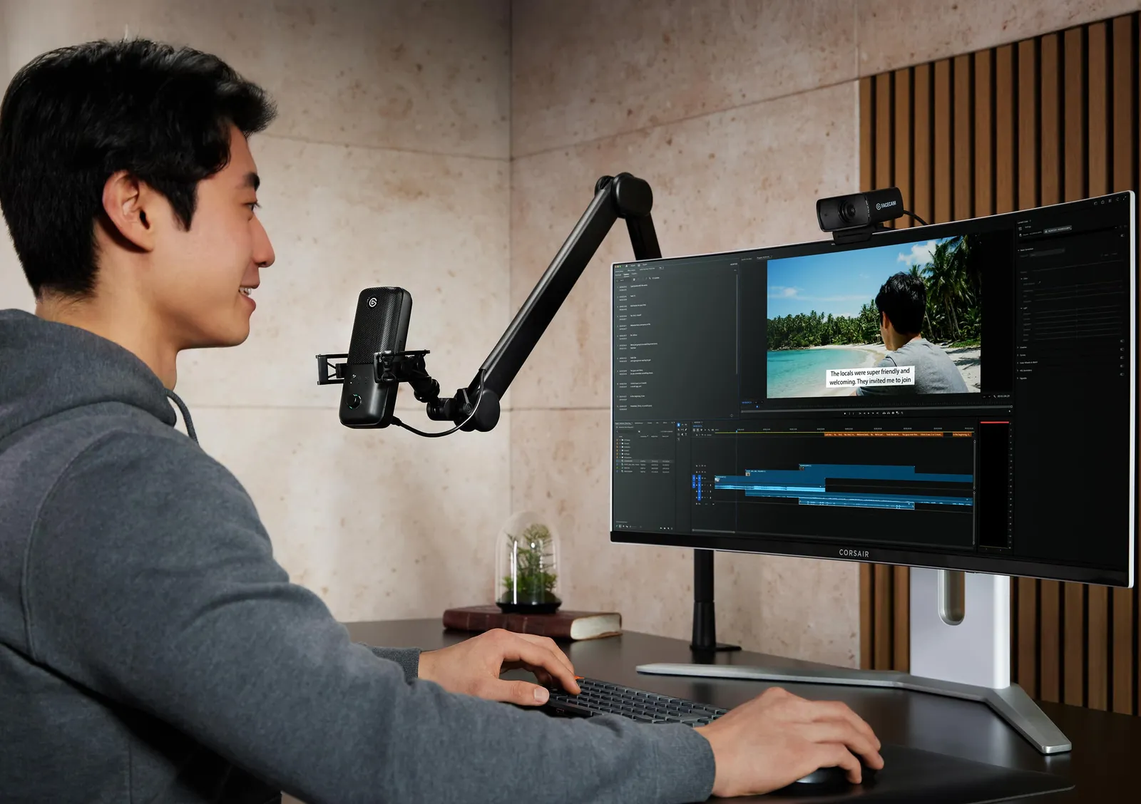 A creator at a desk with an Elgato Wave:3 MK.2 on a boom arm