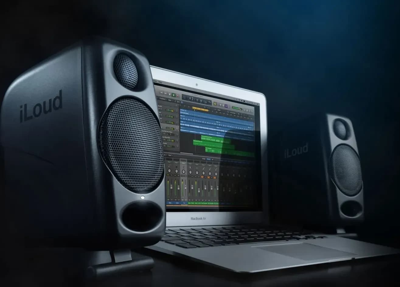 iLoud Micro Monitors either side of a laptop on a desk