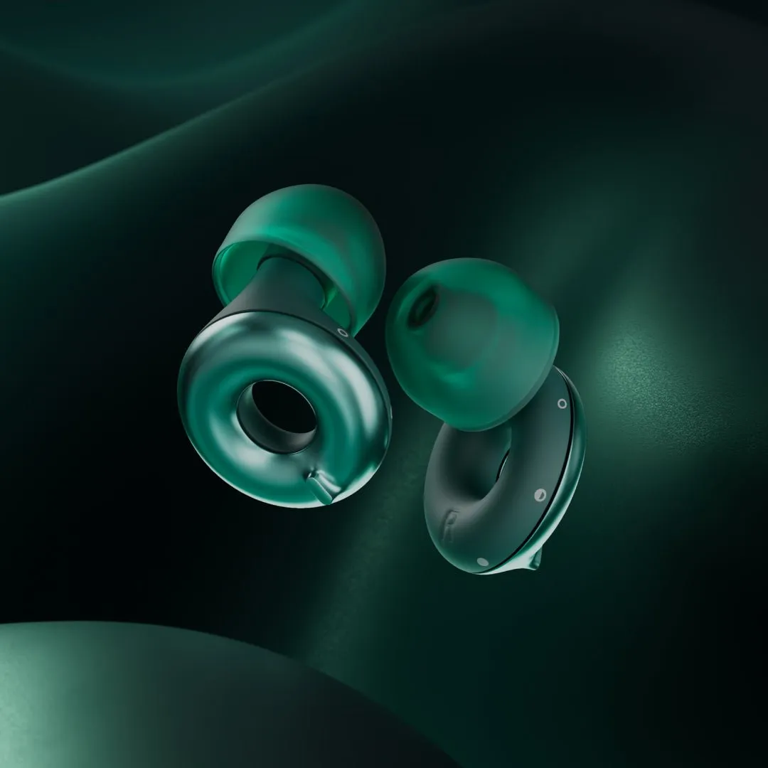 A man wearing a Loop Switch 2 earplug in Emerald