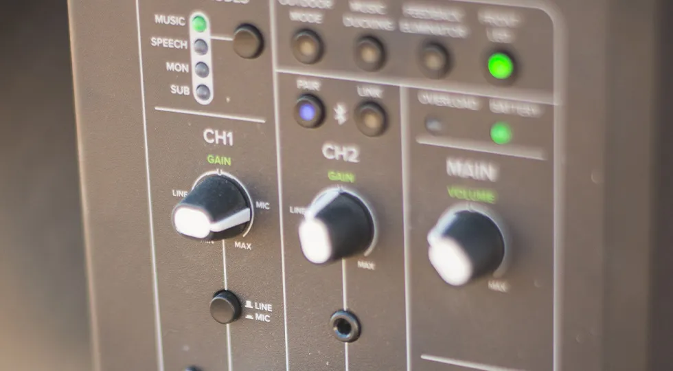 Close-up of the Mackie Thump GO channel gain and main volume controls