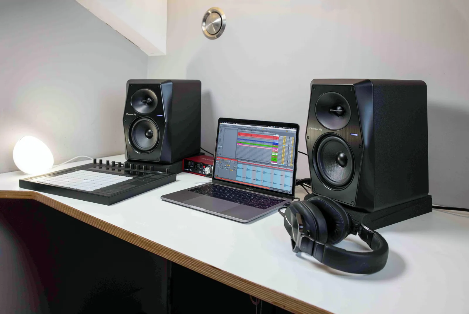 Two Pioneer DJ VM-50 monitors on a desk either side of a laptop