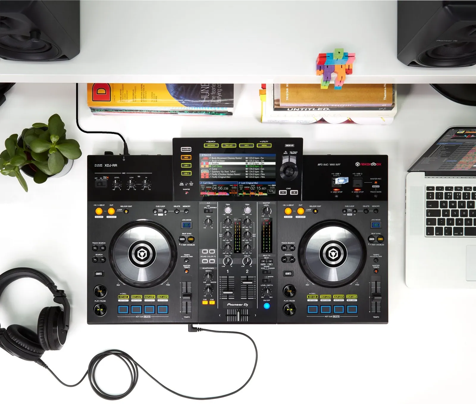 Pioneer DJ XDJ-RR on a desk with headphones and a laptop, seen from above