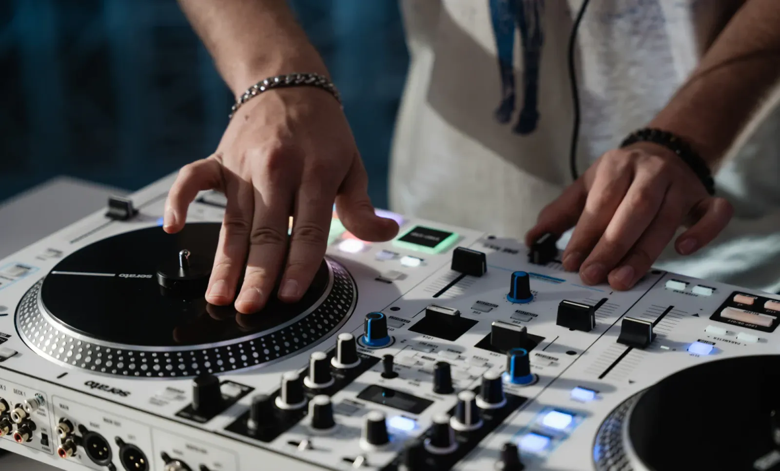 Hands on the platter and mixer of a Rane ONE MKII
