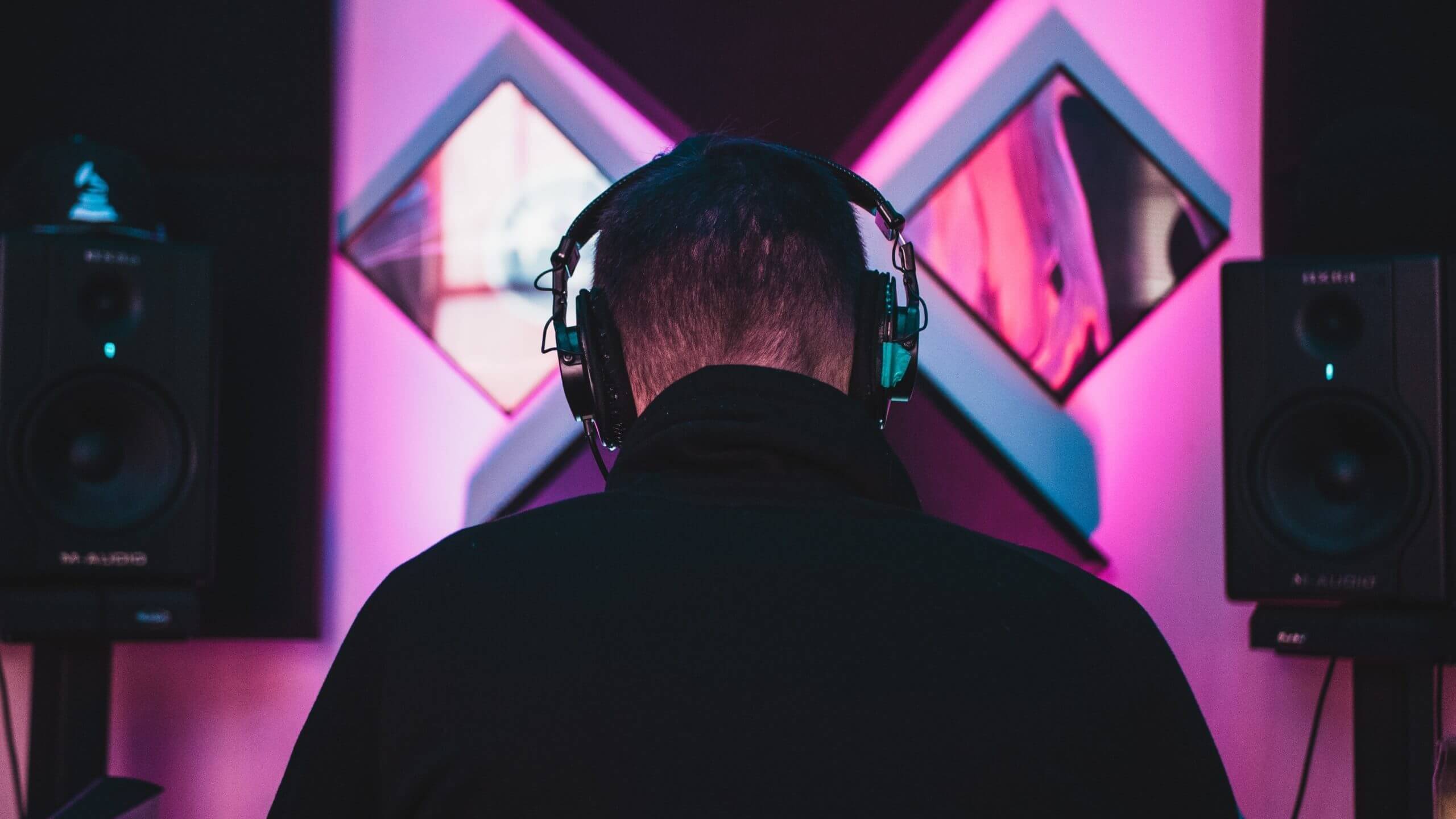 music producer wearing black headphones edited